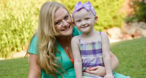 Mom smiling with young daughter