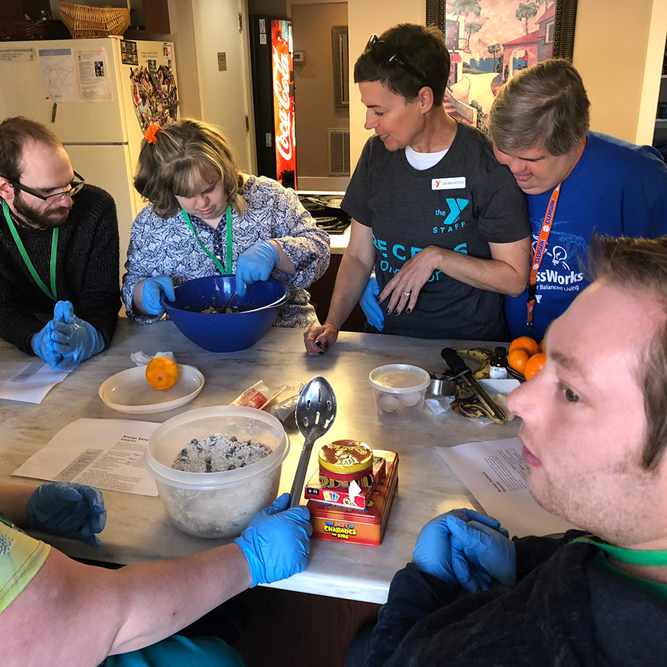 volunteers cooking in kitchen